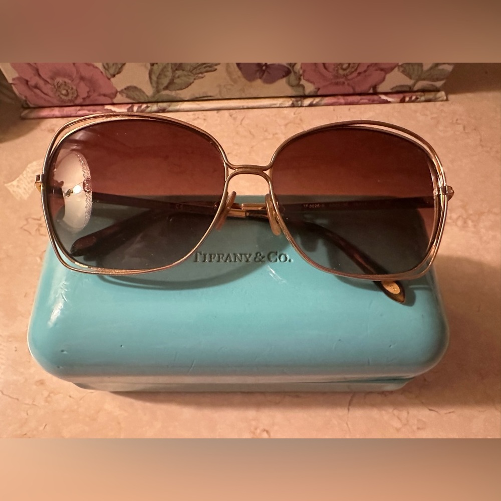 Tiffany and Co. authentic sunglasses medium size frame with jewels and logo.